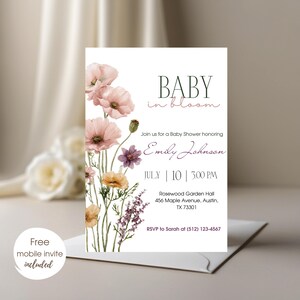May include: A baby shower invitation with floral watercolor illustrations. The invitation features the text "BABY in bloom" and event details, including the name "Emily Johnson", date, time, and location. A free mobile invite is included.