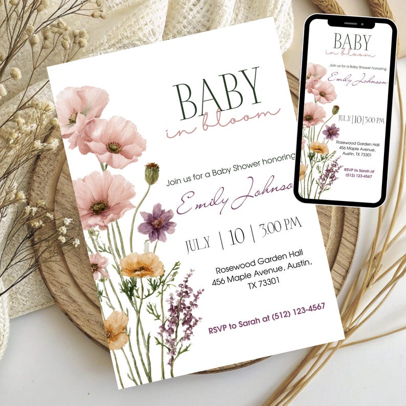 May include: Baby shower invitation with floral watercolor design. The invitation features the text "BABY in bloom" and details for the event, including the date, time, and location. A smartphone displays the same invitation. The design includes pink, purple, and yellow flowers.