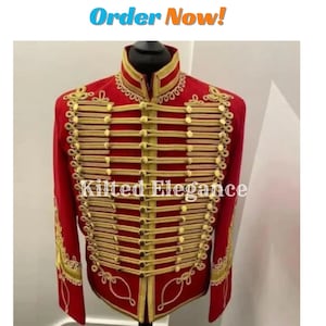 May include: A red military-style jacket with gold trim and detailing. The jacket features a high collar and multiple rows of gold braid across the chest. The text "Kilted Elegance" is visible on the jacket.