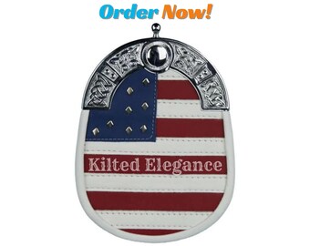 Puede incluir: Un sporran de kilt blanco, rojo y azul, con una parte superior de metal plateado. El diseño incorpora la bandera estadounidense y el texto "Kilted Elegance". El texto superior dice "Order Now!"