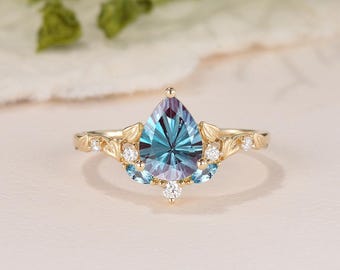 Unieke vuurwerk geslepen peer Alexandrite Heartleaf verlovingsring gezandstraald geelgoud op de natuur geïnspireerd marquise blauwe topaas Starbrite-ring