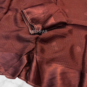 May include: A set of three ceramic mugs with a speckled, matte finish. The mugs are in shades of cream, light gray, and dark gray. Each mug has a simple, minimalist design, perfect for coffee or tea.