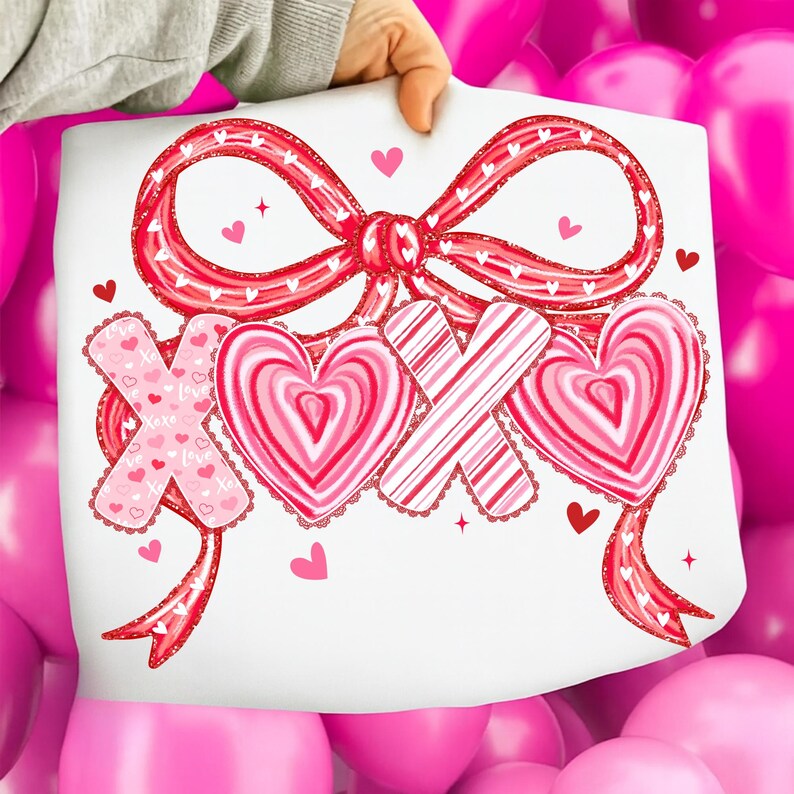 May include: A white sheet featuring a red bow and the letters "XOX" in a Valentine's Day design. The letters are decorated with hearts and stripes in shades of pink and red. Small hearts and stars are scattered around the design.
