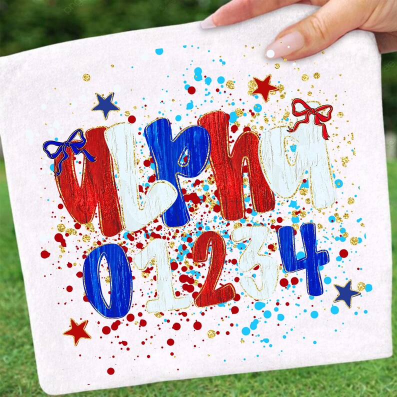 May include: White square fabric with the word "Alpha" and numbers 0-4 in red, white, and blue. The letters and numbers have gold glitter accents and are decorated with bows and stars. Red and blue paint splatters are scattered around the text.