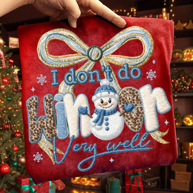 May include: Red decorative pillow with the embroidered phrase "I don't do winter very well." The pillow features a snowman wearing a blue hat and scarf, and the word "winter" has a leopard print design. A large bow is at the top.