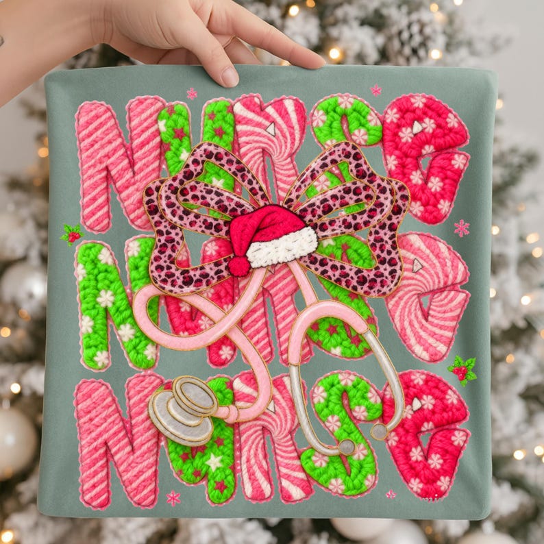 May include: A decorative pillow with the word "NURSE" in pink, green, and white, with a bow and Santa hat. A pink stethoscope is also featured. The design is set against a gray-green background, with a Christmas tree in the background.