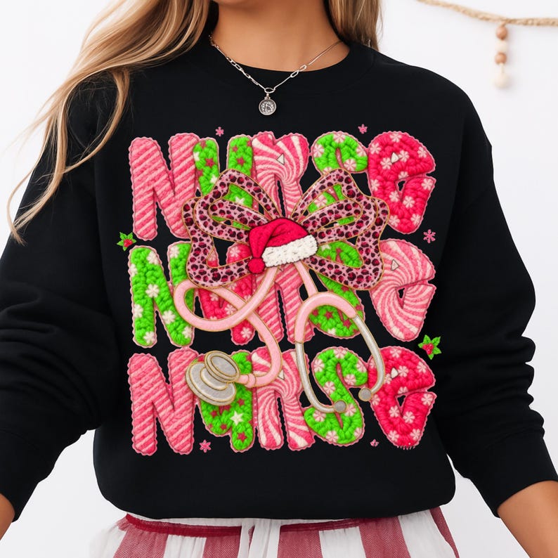 May include: Black sweatshirt with the word "NURSE" in pink and green, with a stethoscope and a bow. The bow has a Santa hat in the center. The letters are decorated with a candy cane design.