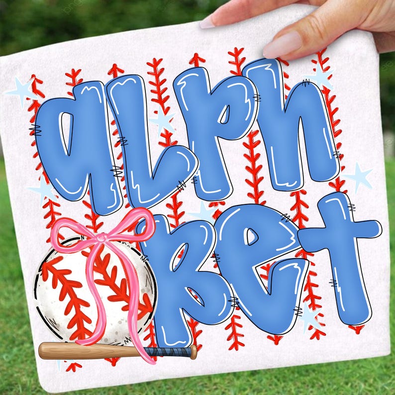 May include: White baseball-themed design with the word "ALPHABET" in blue bubble letters. A baseball with a pink bow and a wooden bat are featured. Red stitching and star accents complete the design.