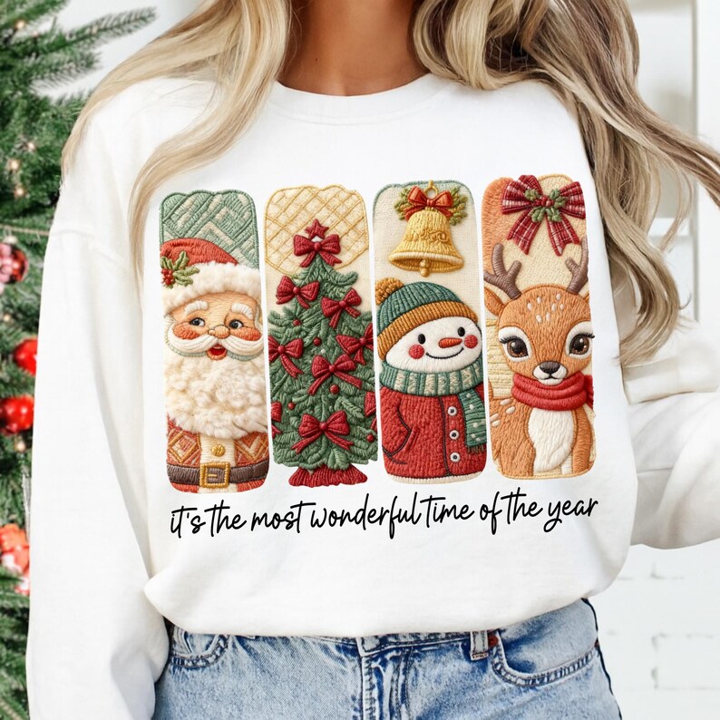 May include: White sweatshirt featuring four Christmas-themed designs: Santa Claus, a Christmas tree, a snowman, and a reindeer. The text "It's the most wonderful time of the year" is printed below the designs. The sweatshirt is worn by a person.