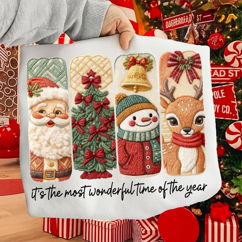 May include: A white Christmas-themed pillowcase featuring embroidered designs of Santa Claus, a Christmas tree, a snowman, and a reindeer. The text "It's the most wonderful time of the year" is written in black script across the bottom.