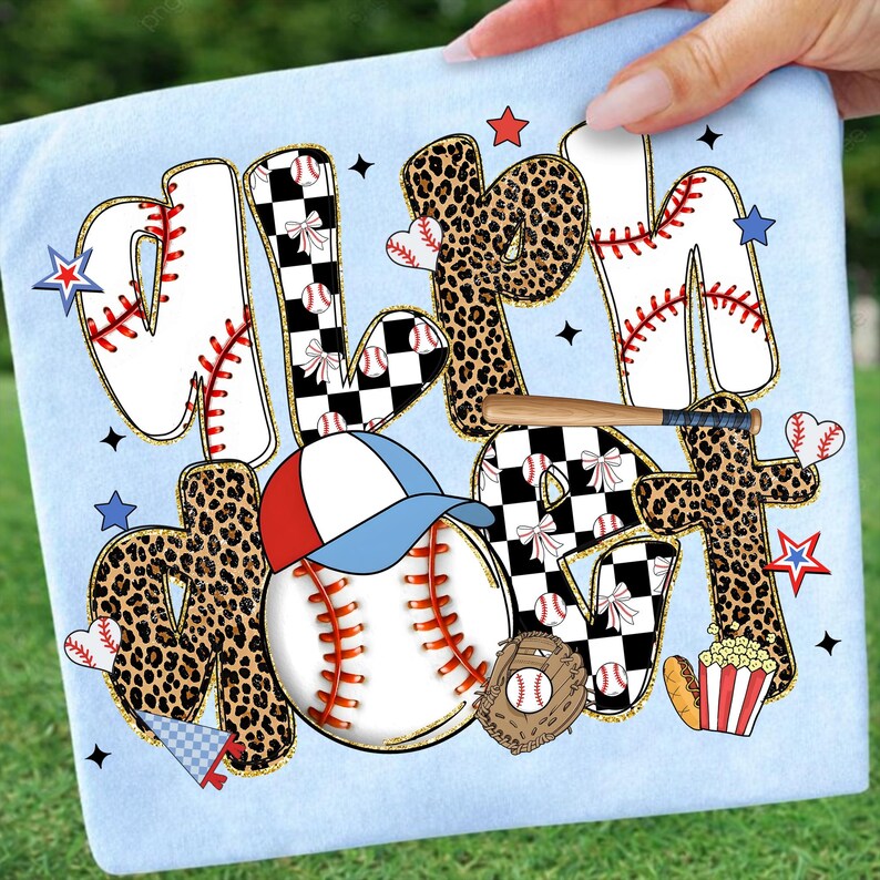 May include: Light blue baseball-themed graphic design on a light blue background. The design includes the words "Mom" and "Heart" with baseballs, a baseball cap, a bat, and stars. The letters have a mix of leopard print, baseball stitching, and checkered patterns.