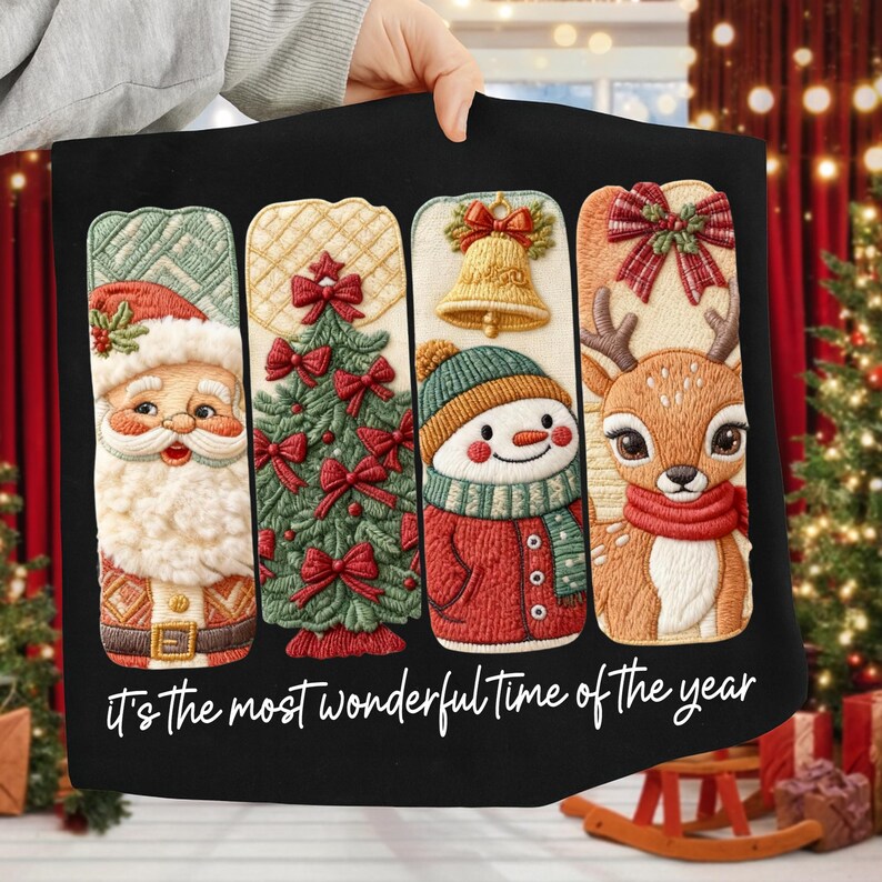 May include: Black Christmas-themed pillow with embroidered designs of Santa Claus, a Christmas tree, a snowman, and a reindeer. The pillow features the text "It's the most wonderful time of the year" in white script.