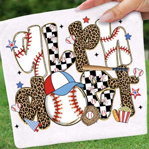 May include: White baseball-themed design with the words "All Star Mom" in a playful font. The letters feature baseball stitching, leopard print, and checkered patterns. Baseball, glove, hat, popcorn, and stars complete the design.
