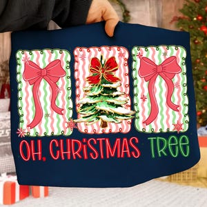 May include: Navy blue Christmas-themed design featuring a central Christmas tree with a red bow, flanked by two pink bows on a striped background. The text "OH. CHRISTMAS TREE" is displayed in red and green, creating a festive holiday design.