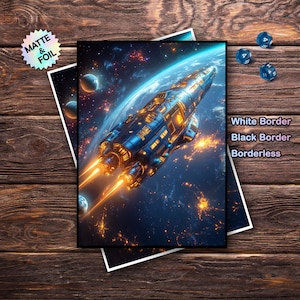 May include: A digital art print of a spaceship in space, with blue and orange hues. The print is on matte and foil paper. The text "White Border, Black Border, Borderless" is visible. Three blue dice are on the wooden surface.