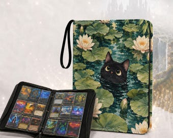 May include: A black trading card binder featuring a cover illustration of a black cat peeking out of a pond with white water lilies and green lily pads. The open binder displays multiple rectangular trading cards in clear plastic pockets.