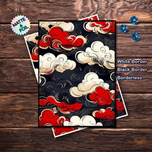 Peut inclure: Une impression avec un motif de nuages stylisé en rouge, blanc et noir. L'impression est disponible avec des bordures blanches, noires ou sans bordure. Les mots "MATTE & FOIL" sont sur un autocollant en haut à gauche. Trois dés bleus sont en haut à droite.