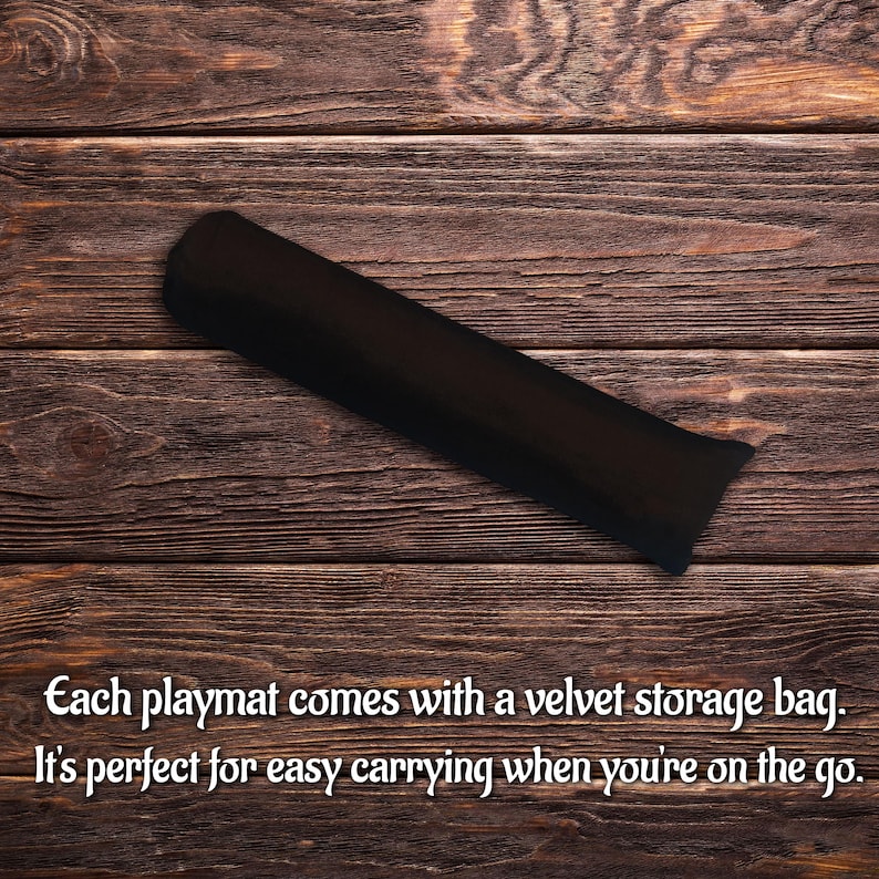 May include: A long, cylindrical black velvet storage bag with a soft, matte texture. The bag is positioned diagonally across the frame. The text on the image reads: Each playmat comes with a velvet storage bag. It's perfect for easy carrying when you're on the go.