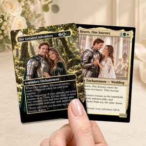 May include: Two custom trading cards featuring fantasy-themed wedding imagery. The left card is titled Our Greatest Adventure, showing a couple in armor and a green gown in a forest. The right card is titled Two Hearts, One Journey, depicting a couple in a castle.