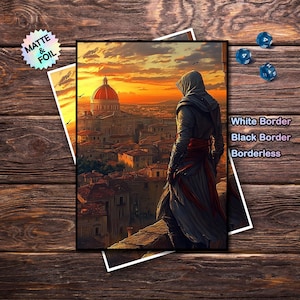May include: A print depicting a figure in a hood looking over a city at sunset. The artwork has a black border and is layered over another print with the text "Matte & Foil". The image also includes three blue dice and text that reads "White Border, Black Border, Borderless".