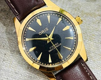 Reloj Oris vintage fabricado en Suiza / Esfera negra, correa de cuero marrón