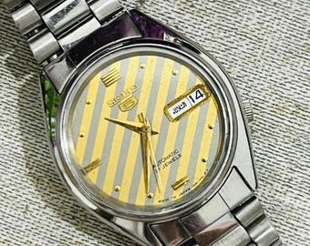 Zegarek na rękę Seiko 5 Automatic w kolorze żółtym, z tarczą z datą i dniem tygodnia, 21 kamieni, wyprodukowany w Japonii