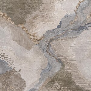 May include: A textured abstract wall art piece featuring a layered composition of beige, taupe, gray, and metallic gold tones. The surface displays varied tactile patterns including raised ridges, fine lines, and stippled areas creating depth.