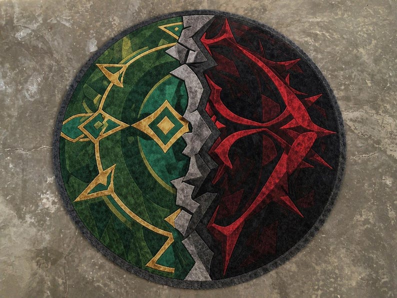 Round hand tufted wool and Tencel rug with green and red abstract split design, top view on neutral background