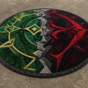 Round hand tufted wool and Tencel rug with green and red abstract split design, angled view on textured neutral floor