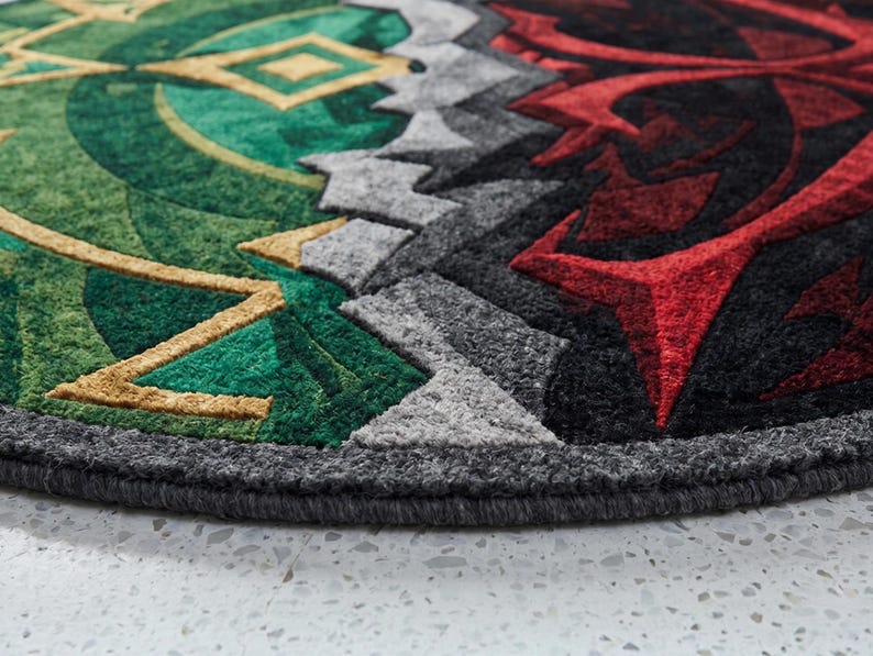 Side view close-up of hand tufted wool and Tencel round rug showing thick edge binding and dense pile texture in green and red abstract design