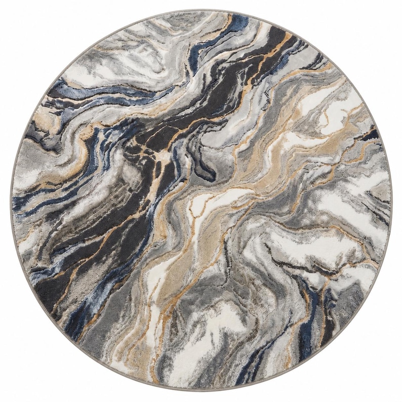 May include: A round area rug with a marbled design. The rug features swirling patterns in shades of gray, black, white, and tan, with subtle hints of navy blue and gold. The rug has a gray border.