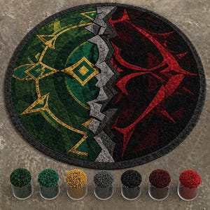 Round hand tufted wool and Tencel rug with green and red abstract split design, shown with yarn color samples on textured floor background