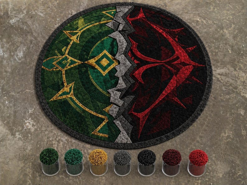 Round hand tufted wool and Tencel rug with green and red abstract split design, shown with yarn color samples on textured floor background