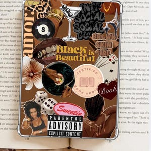 May include: A collage-style phone case featuring various elements: an 8-ball, martini, dice, playing cards, and the words "Black is Beautiful." The design includes a vinyl record, a book, and a photo of a woman. The case has a parental advisory warning.