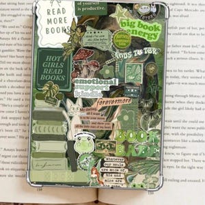 May include: A white ceramic mug with a black handle and the text "But First, Coffee" in a black, bold font. The mug is on a white surface. The mug is approximately 4 inches tall.