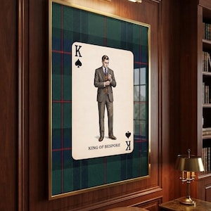 May include: A framed wall art piece featuring a large playing card design with a green and blue plaid background. The card displays a central illustration of a person in a brown suit, the letter K, spade symbols, and the text KING OF BESPOKE.