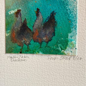 May include: A watercolor painting of three chickens in shades of black, brown, and orange against a teal background. The artwork is signed and titled "Multi Media Chickens" with the number 3/26.