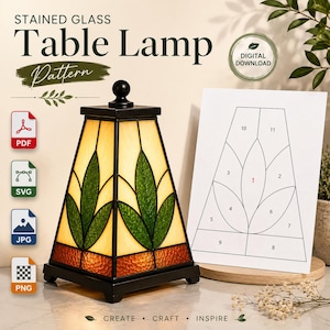 May include: A stained glass table lamp pattern digital download featuring a pyramid-shaped lamp with cream, green, and orange glass panels. Beside it is a white paper template with numbered sections for assembly, labelled PDF, SVG, JPG, and PNG.