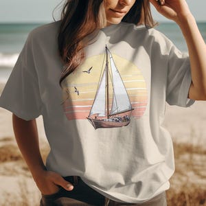 Sailboat T-Shirt, Sunset Scene, Nautical Shirt, Ocean Lover Gift, Sailing Adventure, Coastal Style, Beach T-Shirt, Vacation Shirt