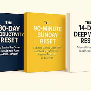 May include: Three hardcover books with the titles "The 30-Day Productivity Reset", "The 90-Minute Sunday Reset", and "The 14-Day Deep Work Reset". Each book has a different color: navy blue, yellow, and white. The books are designed to help with focus.