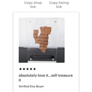 May include: A framed ancient papyrus fragment with visible text. The review states "absolutely love it...will treasure it" and is from a "Verified Etsy Buyer". The image is a screenshot of an Etsy review.