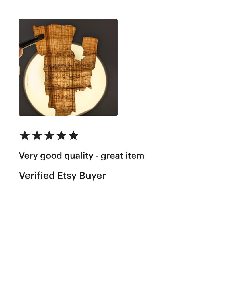 May include: A wooden art piece in the shape of a state, possibly Louisiana, is displayed on a white circular surface against a dark background. The wood has a natural, textured grain. The text "Very good quality - great item" and "Verified Etsy Buyer" are also visible.