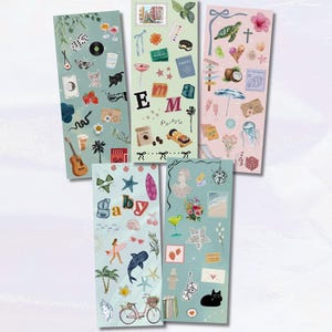 May include: A collection of decorative stickers with various designs. The stickers feature illustrations of cocktails, musical instruments, travel motifs, sea creatures, and the word "baby". The color palette includes shades of blue, pink, and green.