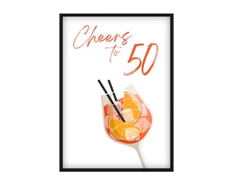 May include: A framed print with a white background features a cocktail illustration. The words "Cheers to 50" are written in orange script above a glass filled with a red drink, ice, and orange slices. Two black straws are in the glass.