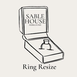 May include: A black and white line drawing of a ring in an open jewelry box. The box is labeled "Sable House Heirlooms." Below the box, the text reads "Ring Resize."