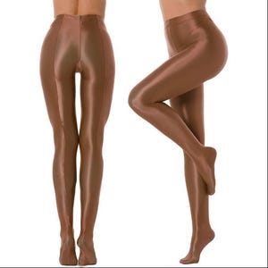 May include: Brown opaque tights. The tights are a solid color with a shiny, satin-like finish. The image shows the tights from the front and side, highlighting the sleek, form-fitting design. The material appears smooth and stretchy.
