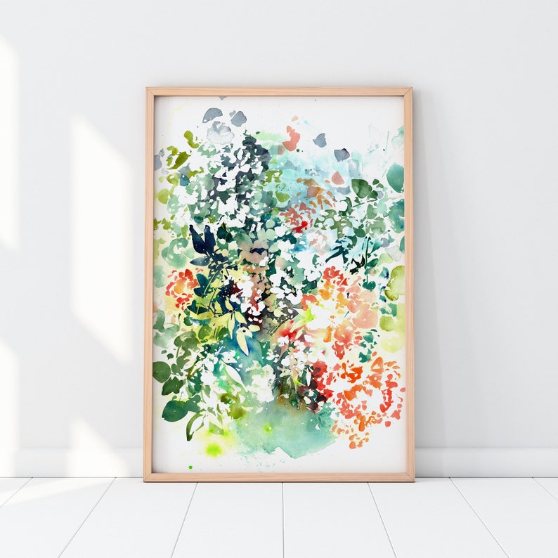 May include: A watercolor painting of a floral bouquet with green leaves, white flowers, and orange and red flowers. The painting is framed in a light wood frame.