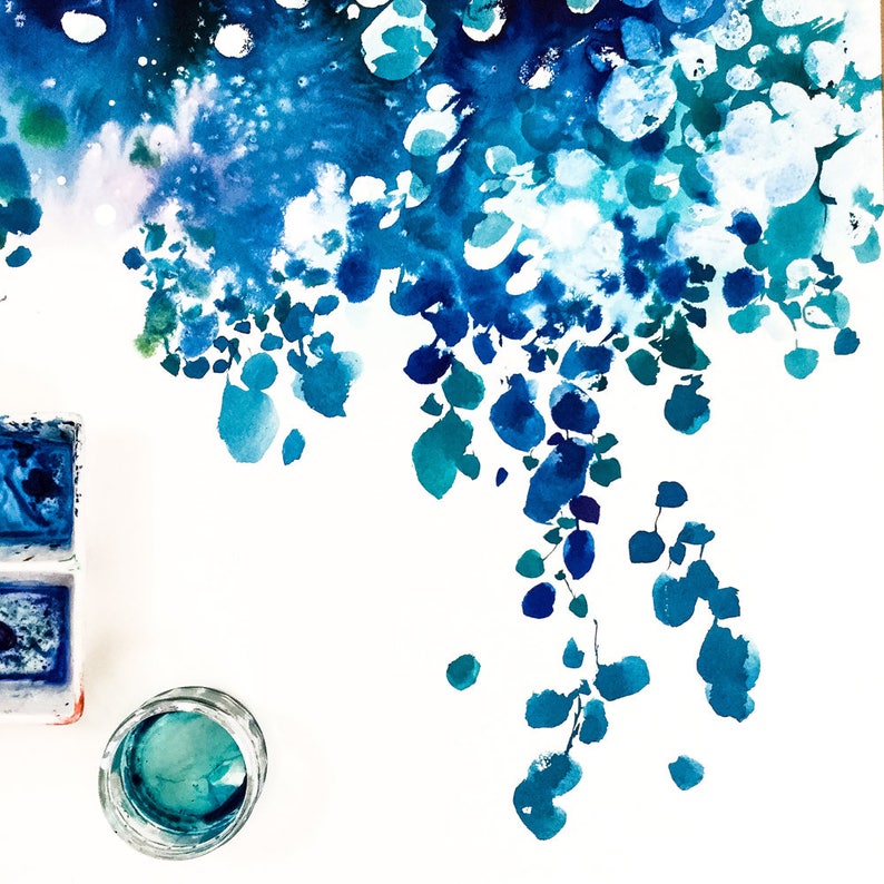 May include: Watercolor painting with a vibrant display of blues and teals. The artwork features abstract shapes and forms, with a focus on flowing, organic patterns. A small glass jar and watercolor palette are visible.