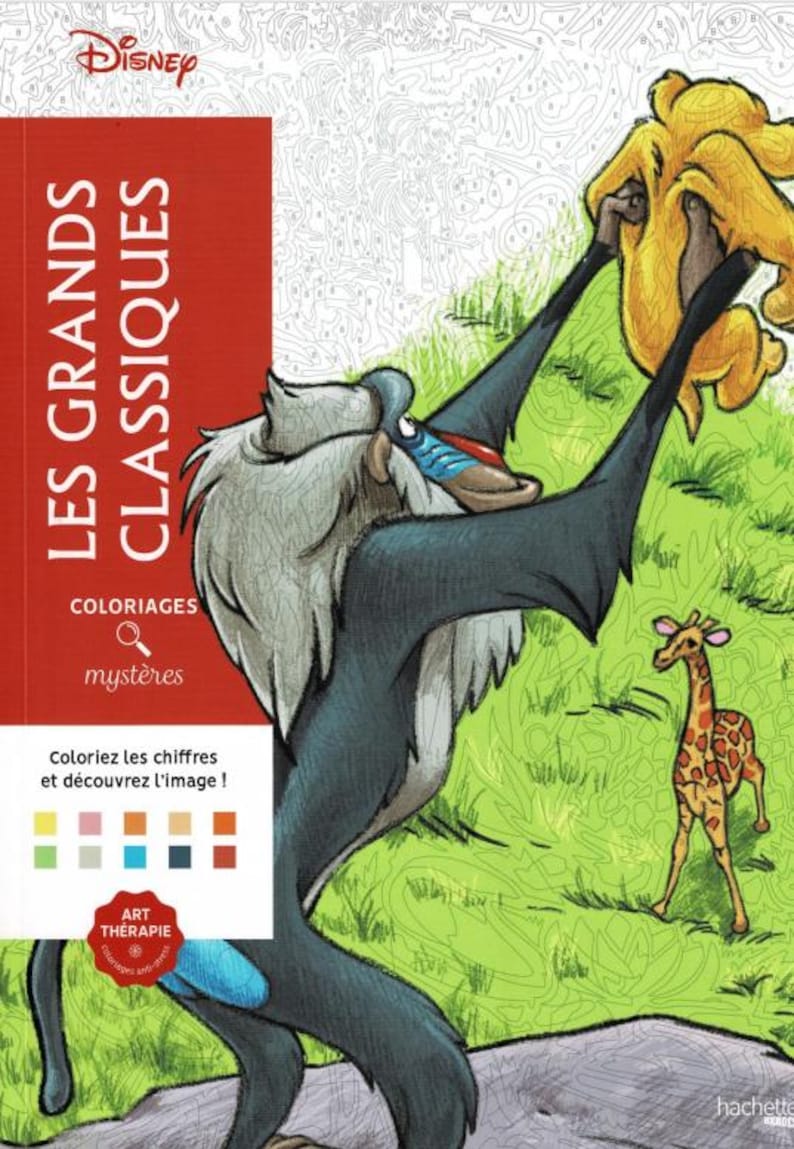 May include: A Disney coloring book titled "LES GRANDS CLASSIQUES" features a vibrant illustration of characters from The Lion King. The cover includes text in French, with a baboon holding up a lion cub, and a giraffe in the background.