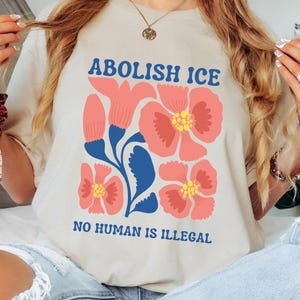 Floral Abolish ICE Human is Illegal Shirt, Political Resistance Shirt, Anti-Trump Activist Wear, No Human is Illegal Top